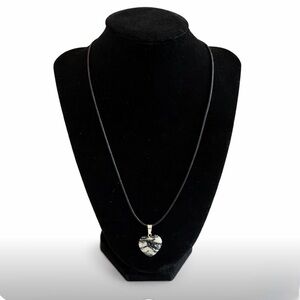 Women’s black and white stone heart necklace.  Black cord with lobster clasp.